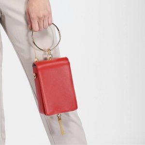 Charles & Keith Circular Handle Clutch